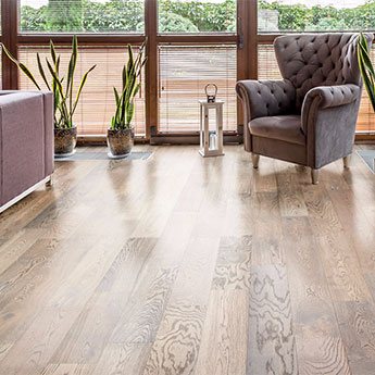 Bright living space finished with natural hardwood flooring