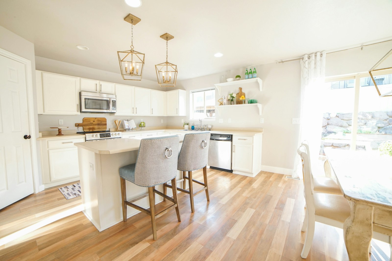 Warm kitchen and living area with wood flooring